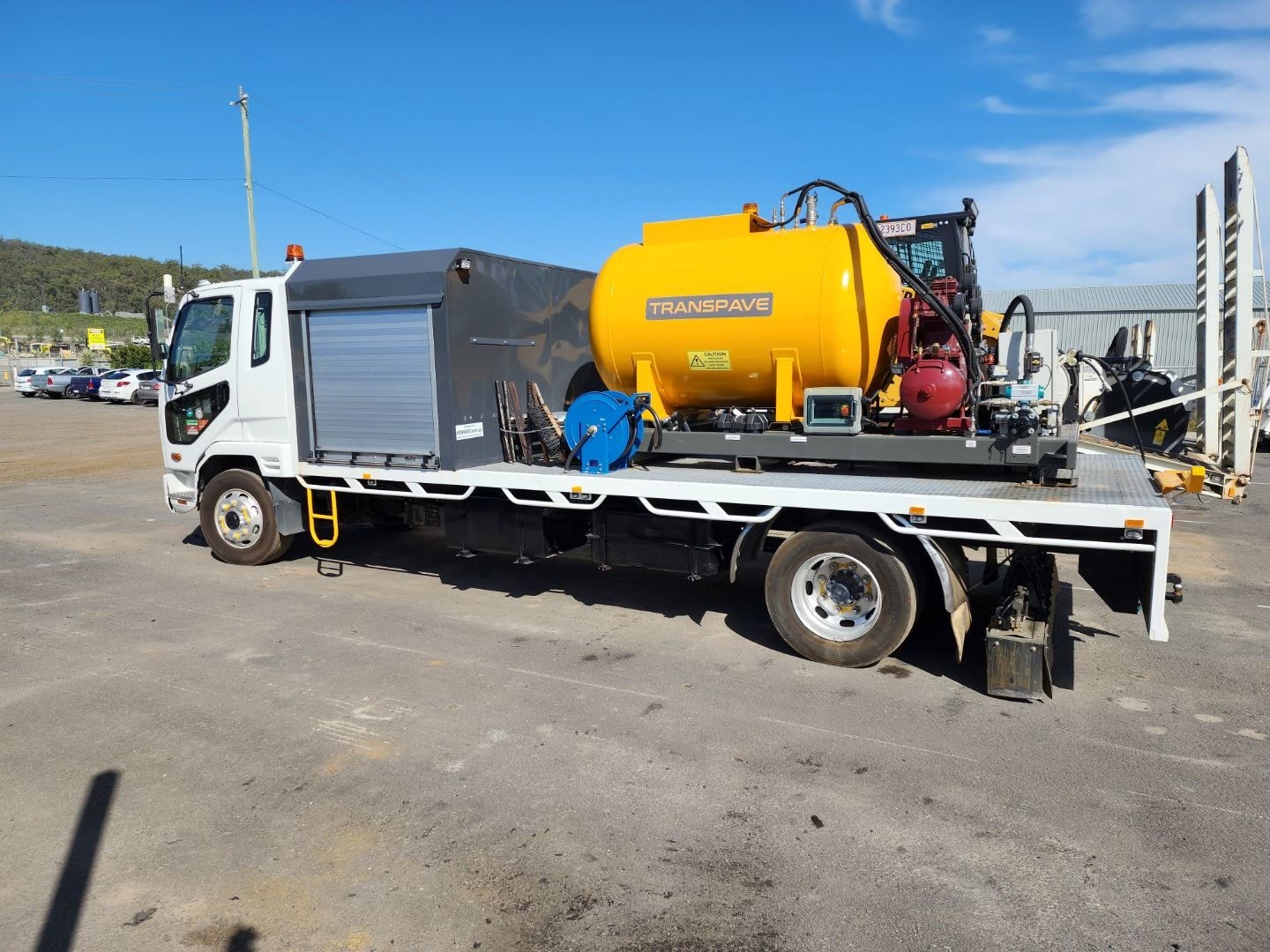 Image of the skid mounted emulsion system retrofitted to a truck.